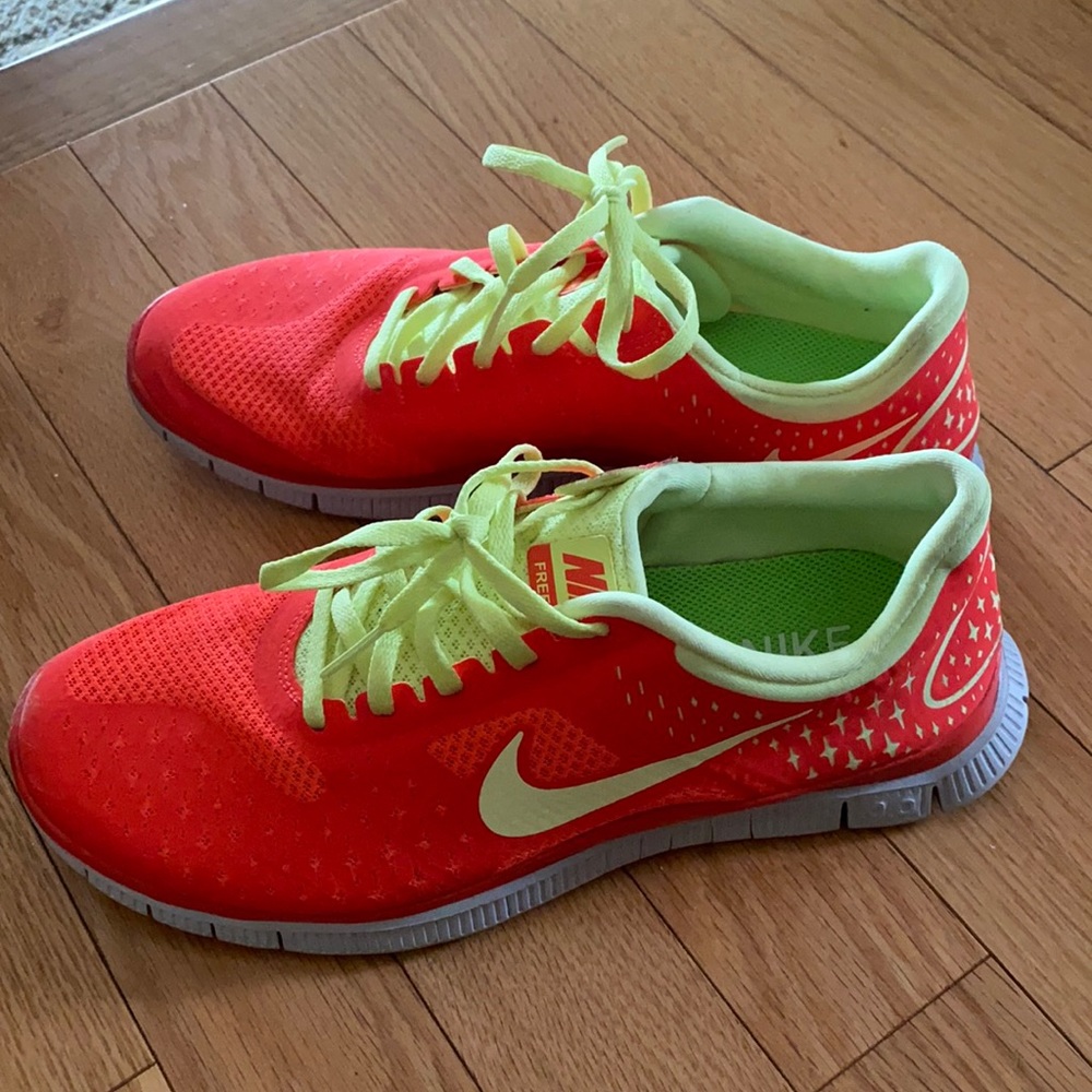 Gently used nike free, women’s size 9.5, bright orange/coral and yellow